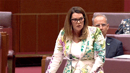 Australian politician waves a salmon