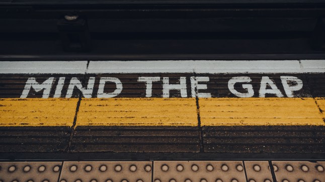Mind the gap sign on of Moorgate underground station platform of London Underground, UK.