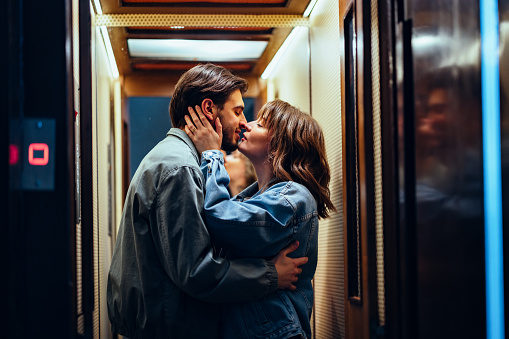 Happy Couple Kissing In The Elevator
