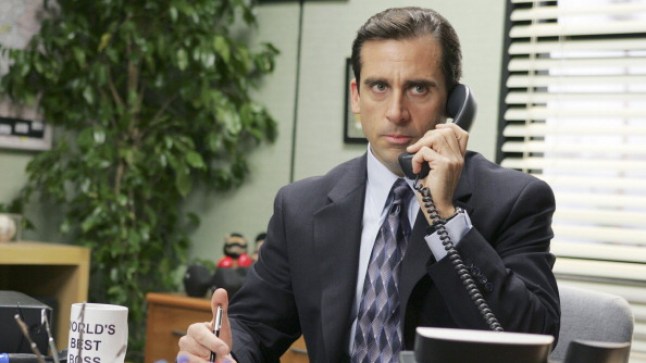 Steve Carell holds phone up to ear in The Office