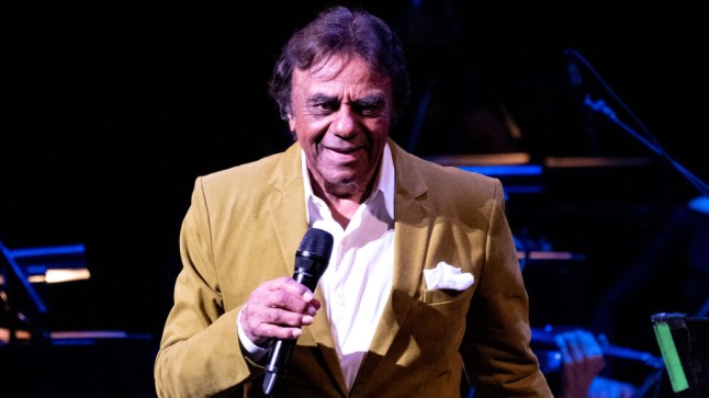 Johnny Mathis performs at Segerstrom Center wearing tan suit and white shirt