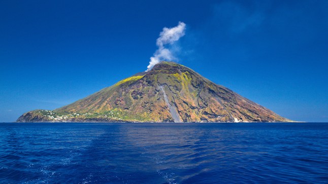 Italy's Mount Stromboli volcano with smoke emerging from the top.