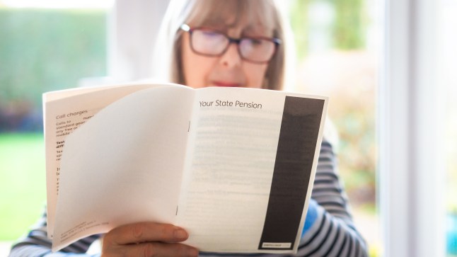 Senior woman reading leaflet about state pension