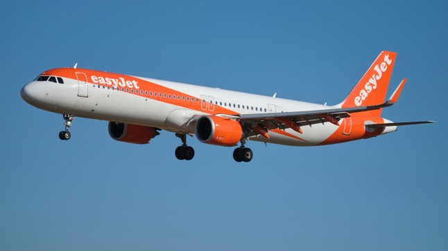 An EasyJet passenger plane mid-flight.