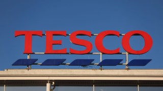 Tesco sign against blue sky