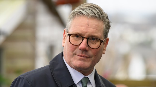 Keir Starmer dressed in a shirt, tie and jacket