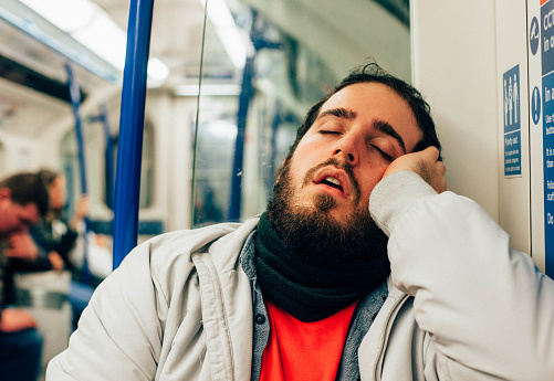 Man sleeping on the subway