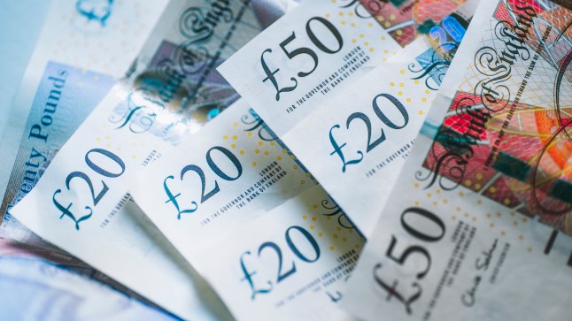 British pound banknotes layered on top of each other.