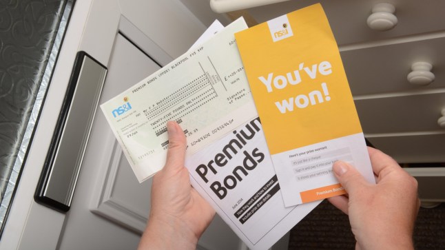 EYHR0D Premium Bonds win, Premium Bonds winner receives prize cheque in post, UK. Image shot 2015. Exact date unknown.