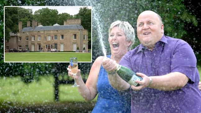 EuroMillions winner Adrian Bayford with ex wife Gillian popping a bottle of champagne.