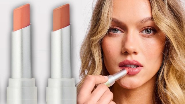 Model posing with Glow Hub lip stick in neutral shade.
