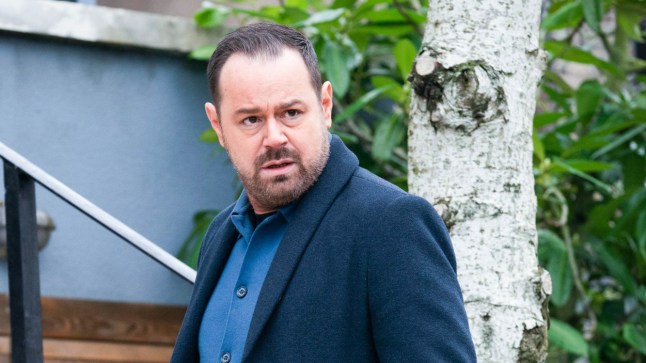 Danny Dyer as Mick Carter, walking through the Square in EastEnders.