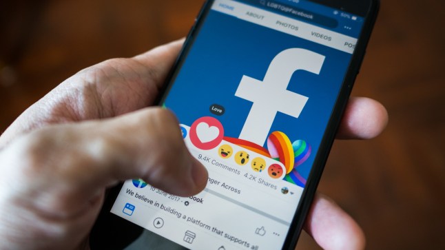 Bangkok, Thailand - March 17, 2018 : Facebook user touch on love button in Facebook application on iPhone 7.; Shutterstock ID 1050961571; purchase_order: -; job: -; client: -; other: -