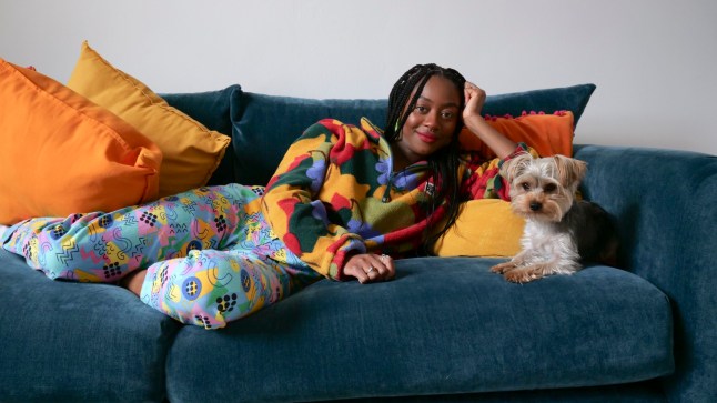 What I Own.. What I rent.. Leila Davis in her home in South London with her dog Bammy and her Budgie Quincy... ?? photograph by David Sandison www.dsandison.com +44 7710 576 445