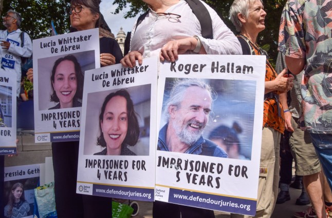 Mandatory Credit: Photo by Vuk Valcic/SOPA Images/Shutterstock (14618948h) Protesters hold pictures of jailed activists Lucia Whittaker De Abreu and Roger Hallam during the demonstration in Parliament Square. Protesters gathered in solidarity with 21 Just Stop Oil activists who are currently in prison for various climate protests. Rally in solidarity with jailed climate activists in Parliament Square, London, UK - 03 Aug 2024