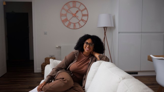 What I Own - Makeup Artist Tia, Acton. Pictured: Tia on her sofa in the living room. Image shot on 8th Sept 2024. ?? Belinda Jiao jiao.bilin@gmail.com 07598931257 https://www.belindajiao.com/about