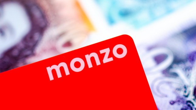 Stone, Staffordshire / United Kingdom - June 20 2019: Monzo bank card logo on a vibrant background of blurred cash. The shallow depth of field is used for the photo. Editorial illustrative photo.; Shutterstock ID 1429823015; purchase_order: -; job: -; client: -; other: -