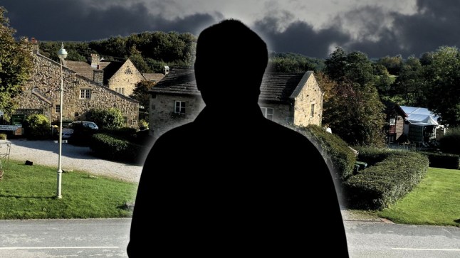 A silhouette of Anthony Fox in front of the Emmerdale village.