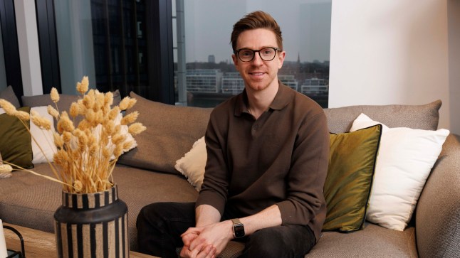 What I Own - Elliot Gleghorn, One Nine Elms, London. Elliot in the living room. Shot on 22nd Jan 2025. (C) Belinda Jiao 07598931257 www.belindajiao.com jiao.bilin@gmail.com