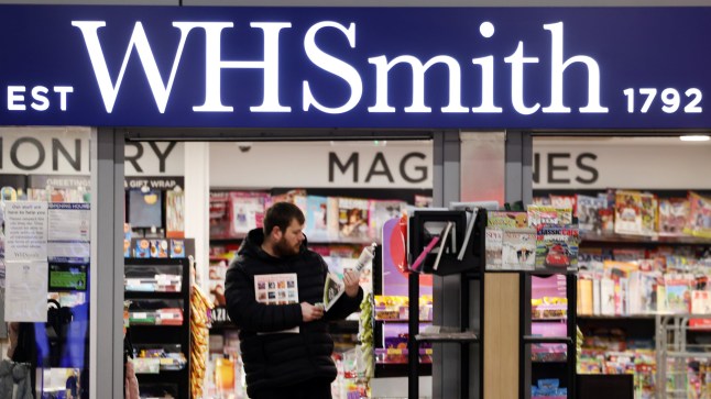 epa11851397 A customer at a WHSmith store in London, Britain, 25 January 2025. British retailer WHSmith said it is exploring options to sell its entire high street business. WHSmith has more than five hundred stores across the UK and employs some five thousand people. EPA/ANDY RAIN