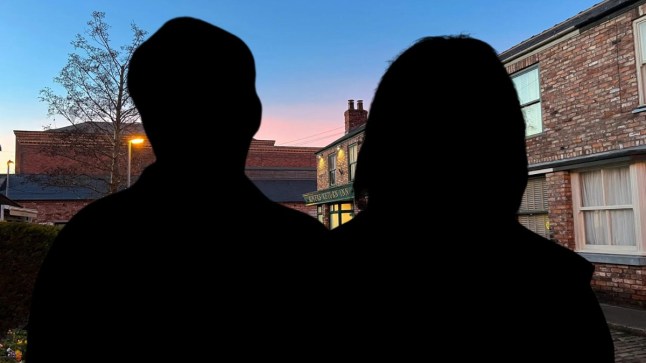 Silhouette of a man and a woman in front of Coronation Street at dusk