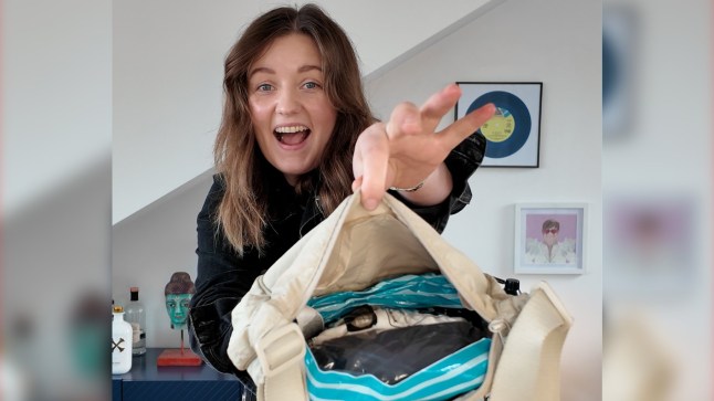 A happy Chelsea Dickenson holds her packed Uniqlo bag to the camera.