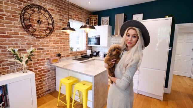 "What I Own"...... Lexie Carducci and her dog Bali at home in the flat she owns in West London.. ?? photograph by David Sandison www.dsandison.com +44 7710 576 445
