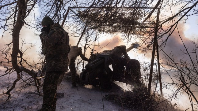 DONETSK OBLAST, UKRAINE - FEBRUARY 17: Ukrainian soldiers of the 117th Brigade fire D-30 artillery in the direction of Pokrovsk, Ukraine on 17 February 2025. (Photo by Diego Herrera Carcedo/Anadolu via Getty Images)