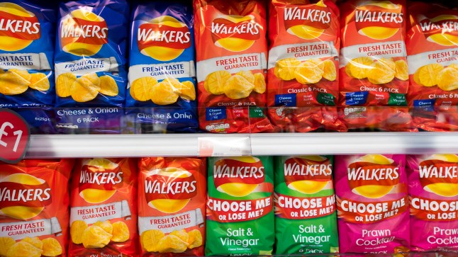 CARDIFF, UNITED Multiple bags of Walkers crisps on display in a supermarket