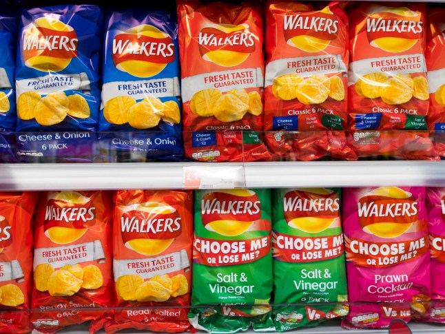 CARDIFF, UNITED Multiple bags of Walkers crisps on display in a supermarket
