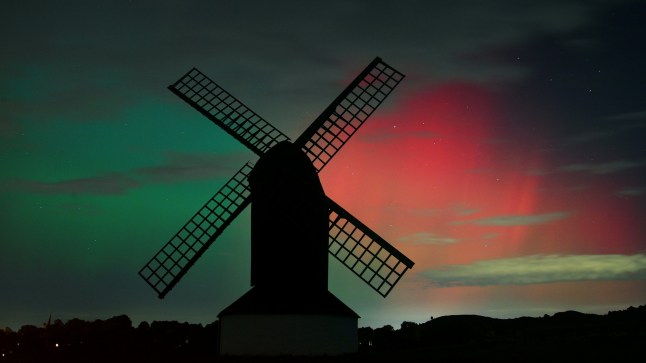 PITSTONE, UNITED KINGDOM - OCTOBER 10: The Aurora Borealis light up the night sky over Pitstone Windmill in Buckinghamshire on October 10, 2024 in Pitstone, United Kingdom. The Aurora Borealis or "Northern Lights" results from geomagnetic storms and can be seen as far south as the UK overnight on the 10th October. (Photo by Jim Dyson/Getty Images)