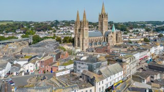 Truro, UK. 5 September 2023. High Street shops with the Cathedral towering over in Truro, Cornwall.