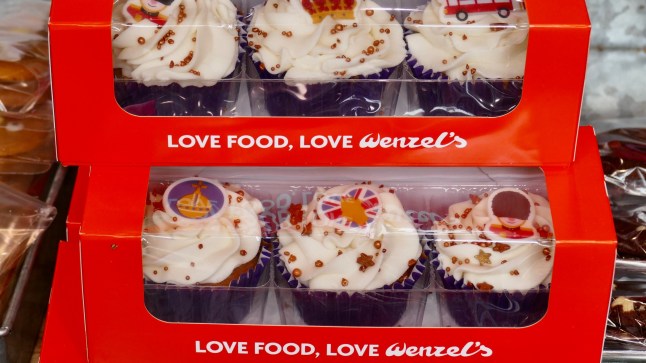 Mandatory Credit: Photo by Geoffrey Swaine/REX/Shutterstock (13892689f) Wenzels the bakery sell King Charles III Coronation themed cakes including donuts with Union Jack flags on top and cupcakes with Grenadier Guards, a crown and a London Bus on the cream topping. Daily life, King Charles Coronation celebration cakes, Reading, Berkshire, UK - 30 Apr 2023
