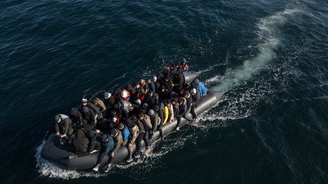 ENGLISH CHANNEL - MARCH 06: An inflatable dinghy carrying around 65 migrants crosses the English Channel on March 06, 2024 in the English Channel. According to official figures 401 migrants arrived in the UK by small boat on Monday, the busiest day of the year so far for Channel crossings. This brings the provisional total number of UK arrivals so far this year to 2,983. Government data indicates this is more than the 2,953 logged this time last year and surpasses the running totals documented between January 1 and March 4 each year since current records began in 2018. (Photo by Dan Kitwood/Getty Images)