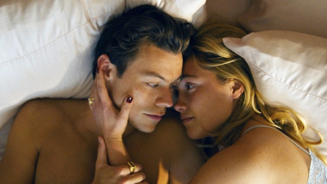 Harry Styles, Florence Pugh, lying in bed in the film Don't Worry Darling