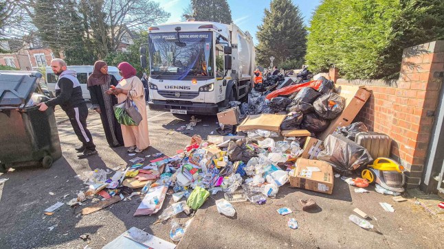 Local residents around mobile waste lorries which pop up daily around Birmingham, amid piles of trash.