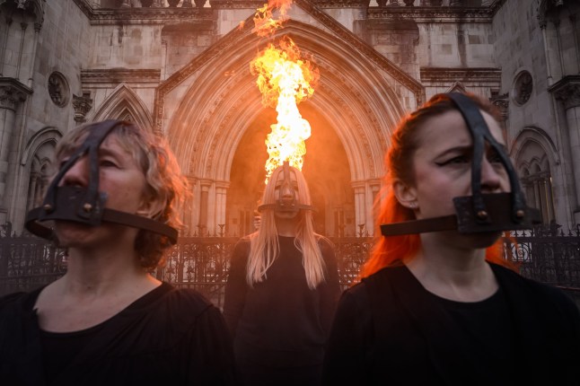 (FILE PHOTO) Supporters of the climate group Just Stop Oil UK have announced after three years of protests, they are ending their campaign of civil resistance with until a final protest in Parliament Square on 26 April,2025. LONDON, ENGLAND - JANUARY 29: Protestors wearing head cages pose outside the Royal Courts of Justice during a protest by environmental campaign group "Just Stop Oil" on January 29, 2025 in London, England. The unprecedented mass hearing by the UK Court of Appeal will consider the convictions of sixteen Just Stop Oil (JSO) campaigners who have been jailed for climate protest actions in four separate cases, resulting in combined prison sentences of over 41 years. The UK has been criticized by human rights watchdogs over it's increasing crackdown and criminalization of climate activism. (Photo by Leon Neal/Getty Images)