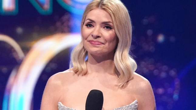 Holly Willoughby on Dancing on Ice holding microphone