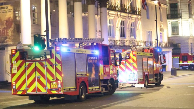 A major emergency response is underway in central London after a man was reported to be on the roof of the New Zealand High Commission in the early hours of this morning. Emergency services were called to New Zealand House, near Trafalgar Square, shortly after 3.30am on Friday following reports of a man at height. Man On Roof Of New Zealand Embassy Triggers Major Emergency Response In Central London Specialist Crews Deployed The Metropolitan Police responded quickly to the alert, deploying specialist rope-trained officers, while London Fire Brigade attended with multiple crews, including an aerial ladder platform to assist in accessing the roof safely. Man On Roof Of New Zealand Embassy Triggers Major Emergency Response In Central London According to a source, building security were alerted after spotting the man on CCTV. Police were called immediately as the individual was seen moving across the roof of the embassy building. Man On Roof Of New Zealand Embassy Triggers Major Emergency Response In Central London A cordon has been established around the scene, and several fire engines and specialist response vehicles from the London Ambulance service remain stationed nearby. Witnesses have described a heavy emergency service presence, with officers and fire crews actively managing the situation. Man On Roof Of New Zealand Embassy Triggers Major Emergency Response In Central London Situation Ongoing At this stage, the man???s motives remain unclear, and it is not known whether he is in communication with police negotiators or has made any demands. Police at the scene have confirmed the incident is ongoing and have urged members of the public to avoid the area for their safety and to allow emergency services to work without obstruction. Official Response Awaited UK News in Pictures?? has contacted the Metropolitan Police for further information and will provide updates as soon as more details are available.