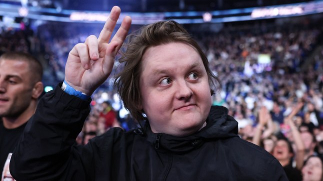 Lewis Capaldi throws up peace sign while in crowd at WWE