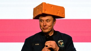 U.S. President Donald Trump's adviser Elon Musk wears a cheese hat as he holds a rally in support of a conservative state Supreme Court candidate of an April 1 election in Green Bay, Wisconsin, U.S. March 30, 2025. REUTERS/Vincent Alban TPX IMAGES OF THE DAY