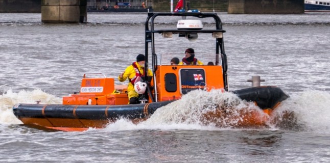 Emergency services have launched a major search and rescue operation after a?? 11 year olg?? girl fell into the River Thames near Woolwich on Monday afternoon. The incident occurred just after 2 pm when it is believed that the child fell into the river, and the mother went in after them in an attempt to save the child. A significant emergency response is currently in place, with crews from the Metropolitan Police, London Ambulance Service, and multiple search and rescue teams actively involved. The operation also includes the Coast Guard, Border Force vessels, and a search and rescue helicopter. Emergency services were called to the scene shortly after the incident unfolded, and a large presence remains along the riverbank as the search continues. Authorities are using boats, drones, and aerial support in a desperate bid to locate the missing?? child. Despite the extensive efforts, there has been no confirmation of any recovery at this time. A spokesperson from the Metropolitan Police stated that efforts to find the child?? are ongoing and that they are working closely with other emergency services. The London Ambulance Service has also been involved, with paramedics on standby at the scene. Witnesses reported seeing a large number of emergency vehicles and personnel in the area, and members of the public are being asked to avoid the vicinity to allow search teams to work without disruption. Local residents and passersby have expressed their concern, with some gathering at a distance as the search continues. Anyone with information or who witnessed the incident is urged to contact the Metropolitan Police. A Spokesman for the Met Police said: Police were called at around 1.15pm on Monday, 31 March to reports of an 11-year-old girl who had entered the River Thames near to Barge House Causeway, E16.