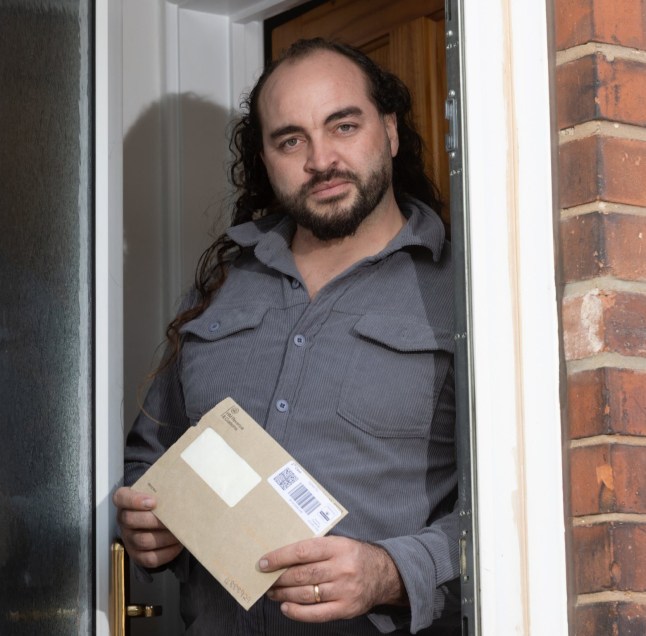 Nathan stood by his front door.