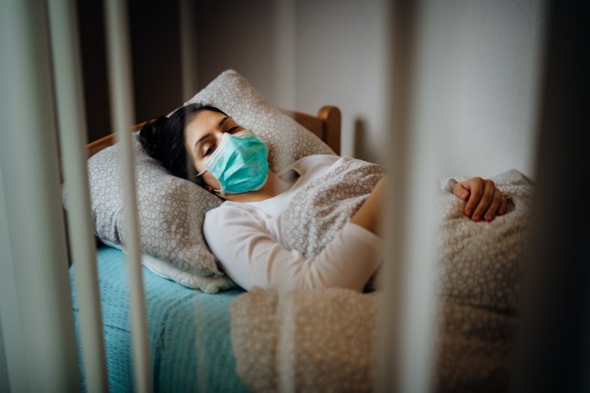 Infected woman with mask in mobile quarantine hospital units isolation.Coronavirus patient having pneumonia disease symptoms.Health care.Attacked immune system.Medical help.Recovery from virus