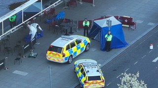 A man has been shot dead by police at Milton Keynes railway station after reports of a man carrying a firearm. Incident Details The incident occurred shortly before 1 pm today (April 1) when officers from Thames Valley Police and British Transport Police were alerted to reports of an armed man at the busy railway station. Armed officers from Thames Valley Police arrived at the scene and confronted the man. During the confrontation, shots were fired by police. Despite immediate medical assistance, the man was pronounced dead at 1:44 pm. Police Statement A spokesperson from Thames Valley Police said: Armed officers responded to reports of a man carrying a firearm at Milton Keynes railway station at 12:55 pm. Officers challenged the man, and shots were subsequently fired. Despite attempts to save him, the man was pronounced dead at 1:44 pm." Police have confirmed that they do not believe there is any further risk to the public following the incident. Investigation and Public Reassurance An investigation has been launched to establish the circumstances leading to the shooting. The Independent Office for Police Conduct (IOPC) has been informed, as is standard procedure in such incidents. The railway station remained cordoned off as forensic teams and investigators worked at the scene. Commuters were redirected, and train services faced disruption. Passengers were advised to check for updates before traveling. Public Safety Authorities have reassured the public that the situation has been contained and that there is no ongoing threat. However, the incident has caused significant concern among commuters and local residents. Witnesses are urged to come forward with any information or footage that may assist the investigation. This is a developing story. Further updates will be provided as more information becomes available.