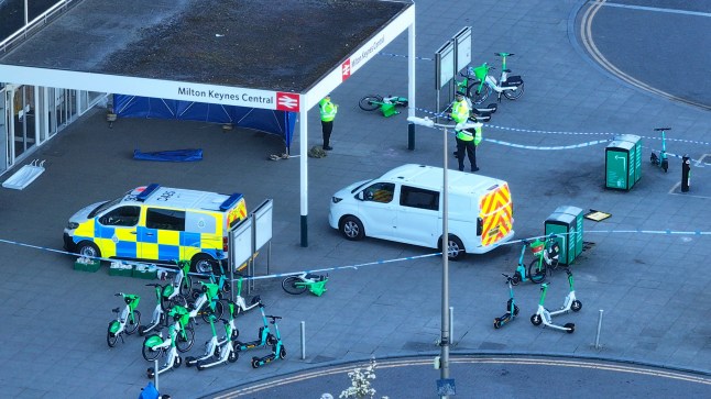 A man has been shot dead by police at Milton Keynes railway station after reports of a man carrying a firearm. Incident Details The incident occurred shortly before 1 pm today (April 1) when officers from Thames Valley Police and British Transport Police were alerted to reports of an armed man at the busy railway station. Armed officers from Thames Valley Police arrived at the scene and confronted the man. During the confrontation, shots were fired by police. Despite immediate medical assistance, the man was pronounced dead at 1:44 pm. Police Statement A spokesperson from Thames Valley Police said: Armed officers responded to reports of a man carrying a firearm at Milton Keynes railway station at 12:55 pm. Officers challenged the man, and shots were subsequently fired. Despite attempts to save him, the man was pronounced dead at 1:44 pm." Police have confirmed that they do not believe there is any further risk to the public following the incident. Investigation and Public Reassurance An investigation has been launched to establish the circumstances leading to the shooting. The Independent Office for Police Conduct (IOPC) has been informed, as is standard procedure in such incidents. The railway station remained cordoned off as forensic teams and investigators worked at the scene. Commuters were redirected, and train services faced disruption. Passengers were advised to check for updates before traveling. Public Safety Authorities have reassured the public that the situation has been contained and that there is no ongoing threat. However, the incident has caused significant concern among commuters and local residents. Witnesses are urged to come forward with any information or footage that may assist the investigation. This is a developing story. Further updates will be provided as more information becomes available.